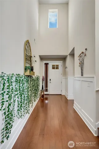 a view of an entryway with wooden floor