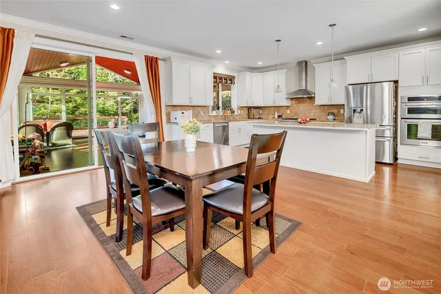 a view of a dining room with furniture window and outside view
