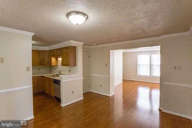 a kitchen with a stove and white cabinets