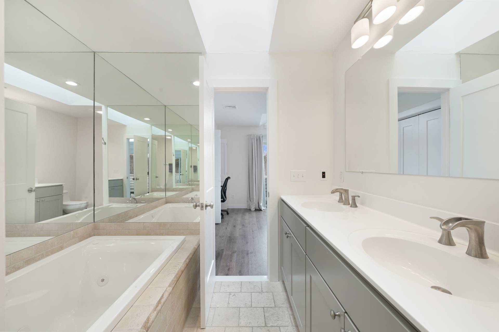 Undisclosed Address Westhampton, NY 11977 - Photo 13 of 18 a bathroom with a tub a sink a mirror and a shower