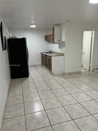 a kitchen with stainless steel appliances a sink and a cabinets