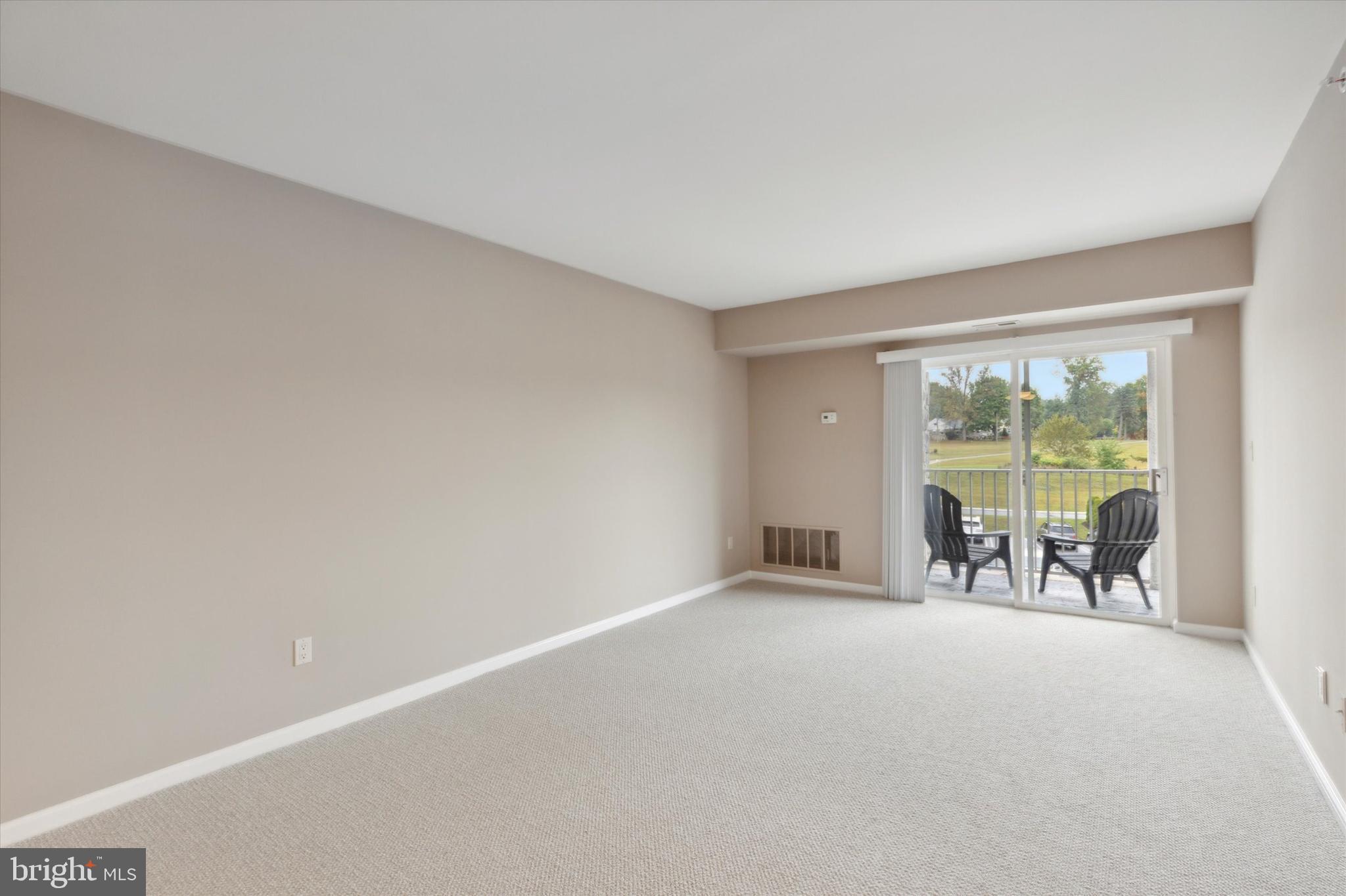 143 Brandon Road Norristown, PA 19403 - Photo 5 of 18 Living area with sliding door to balcony