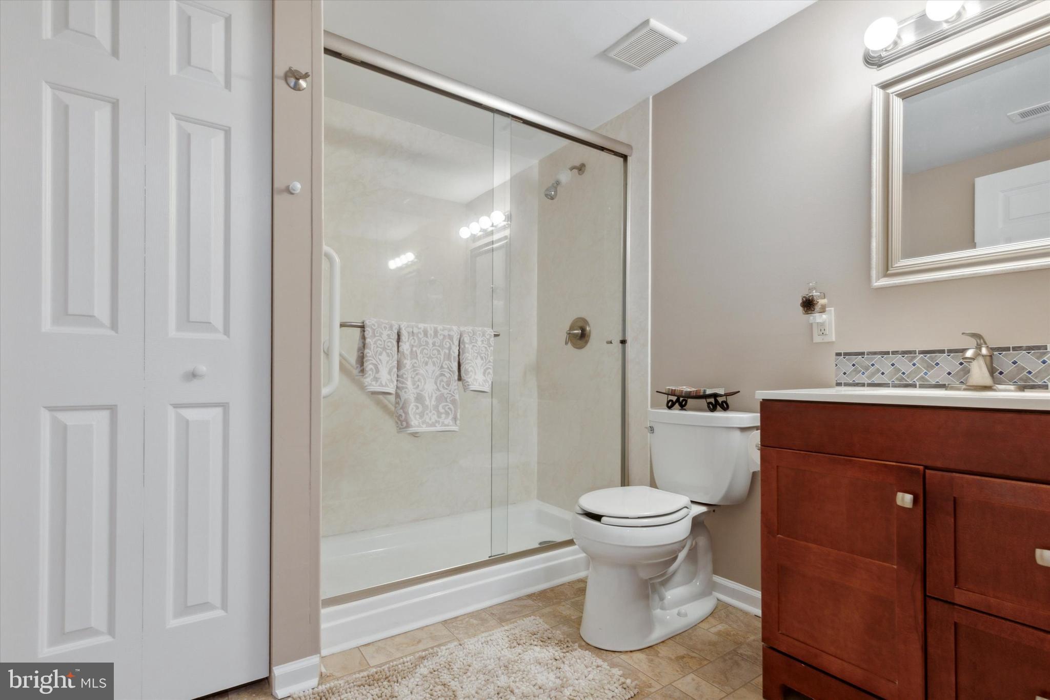 143 Brandon Road Norristown, PA 19403 - Photo 10 of 18 Bathroom with stall shower and linen closet