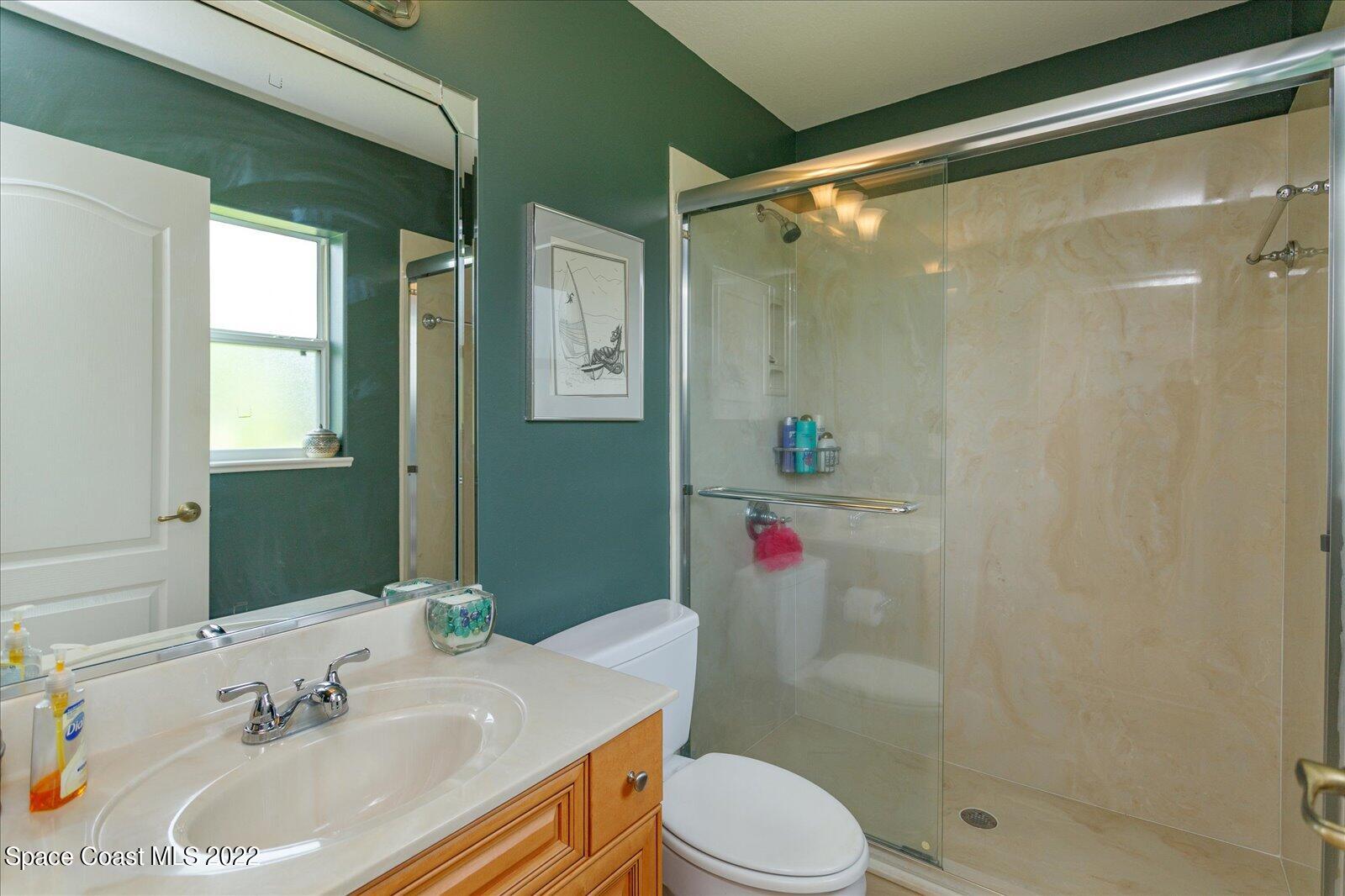 3720 Pine Cone Road Melbourne, FL 32934 - Photo 27 of 34 a bathroom with a sink toilet and shower