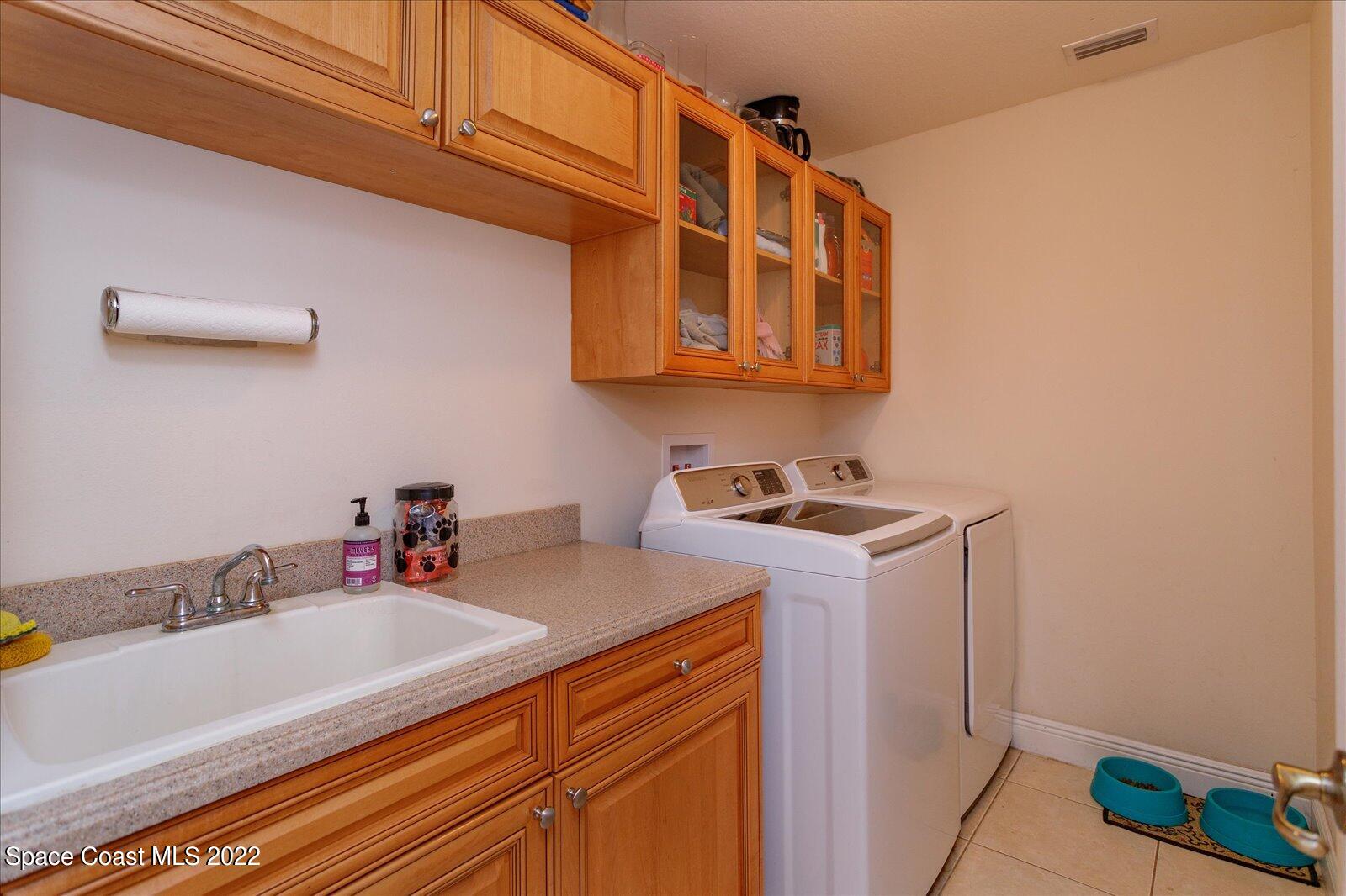 3720 Pine Cone Road Melbourne, FL 32934 - Photo 31 of 34 Large Laundry w/tons of storage!