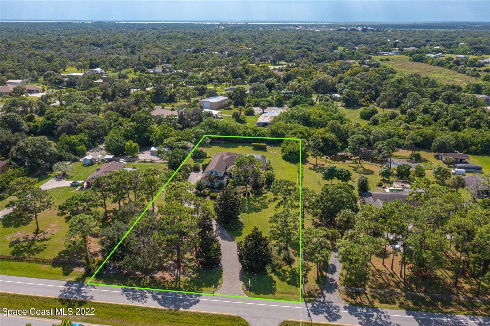 3720 Pine Cone Road Melbourne, FL 32934 - Photo 6 of 34 an aerial view of residential houses with outdoor space and trees