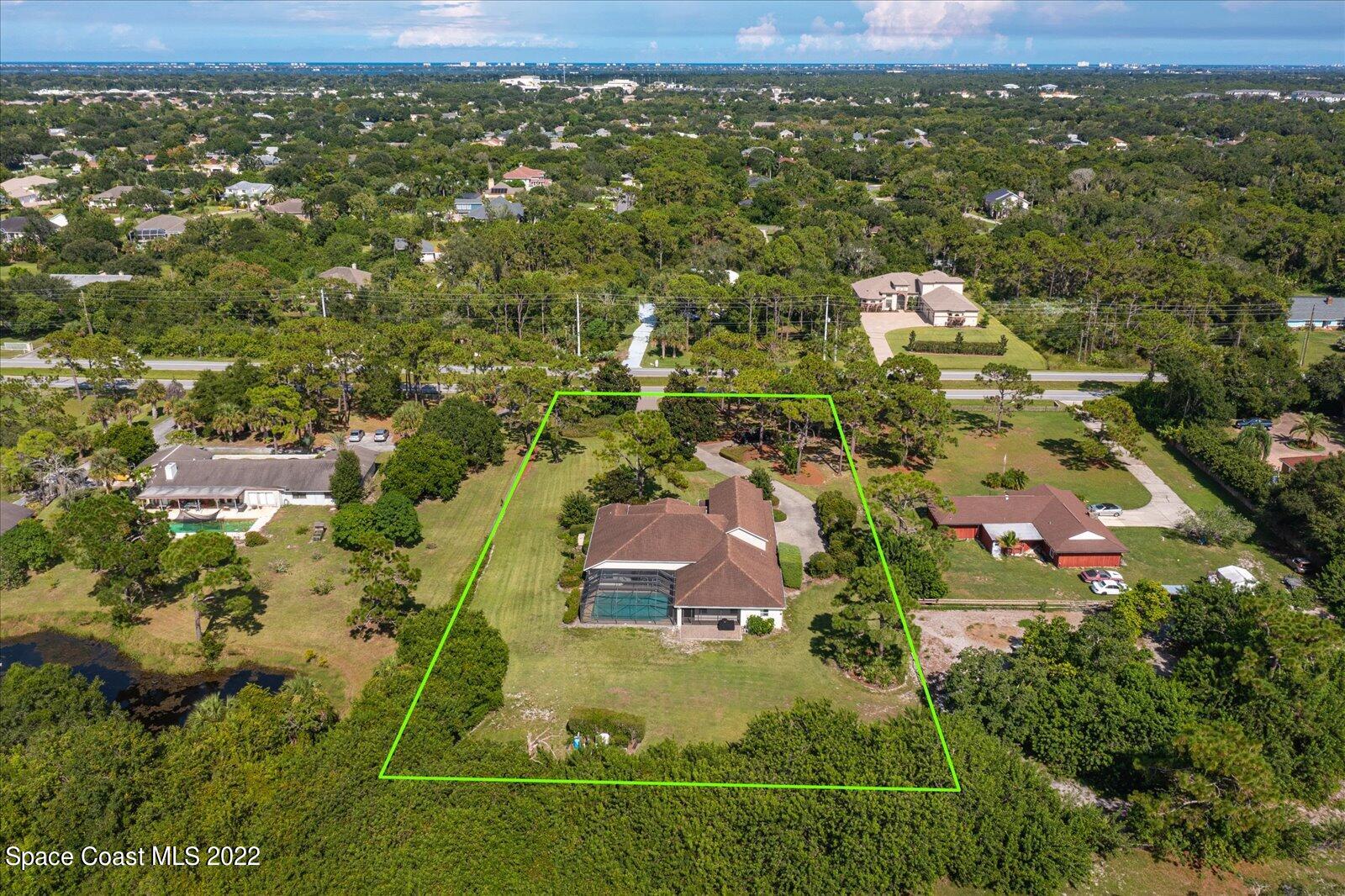 3720 Pine Cone Road Melbourne, FL 32934 - Photo 7 of 34 an aerial view of residential houses with outdoor space