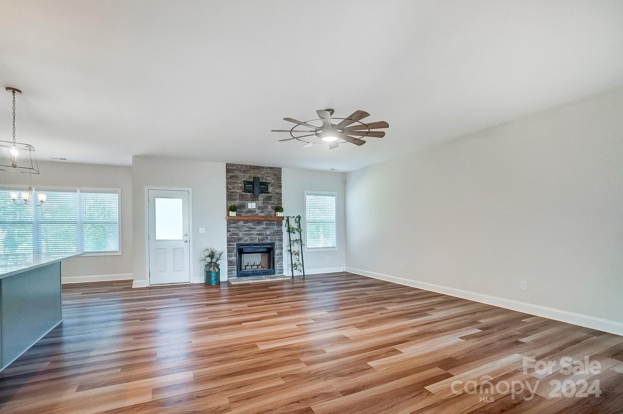 1413 Hamilton Crossroads Road Marshville, NC 28103 - Photo 11 of 42 wooden floor in an empty room with a window