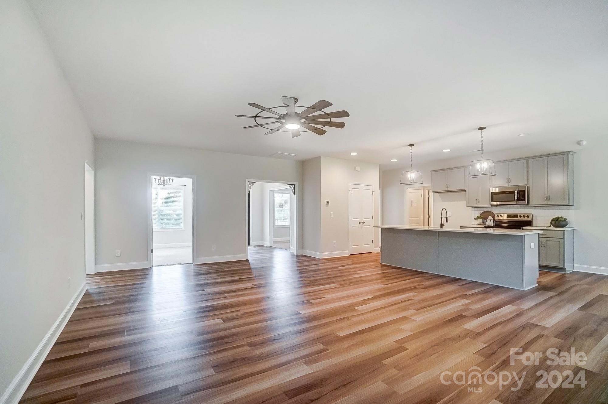 1413 Hamilton Crossroads Road Marshville, NC 28103 - Photo 12 of 42 a view of kitchen with sink and wooden floor
