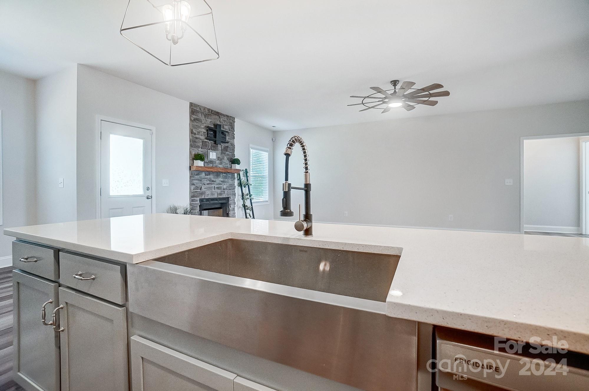 1413 Hamilton Crossroads Road Marshville, NC 28103 - Photo 16 of 42 a view white cabinets a sink and dishwasher