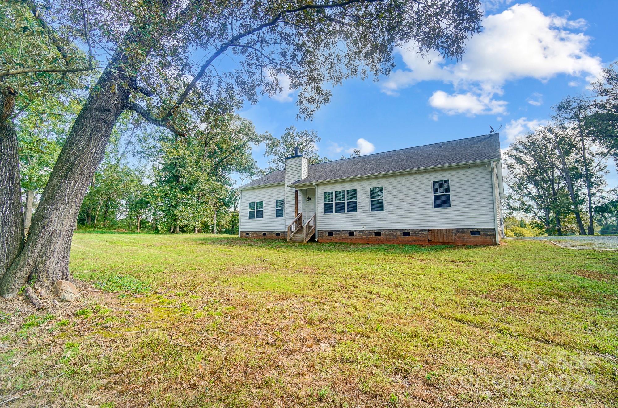 1413 Hamilton Crossroads Road Marshville, NC 28103 - Photo 39 of 42 a front view of a house with a garden