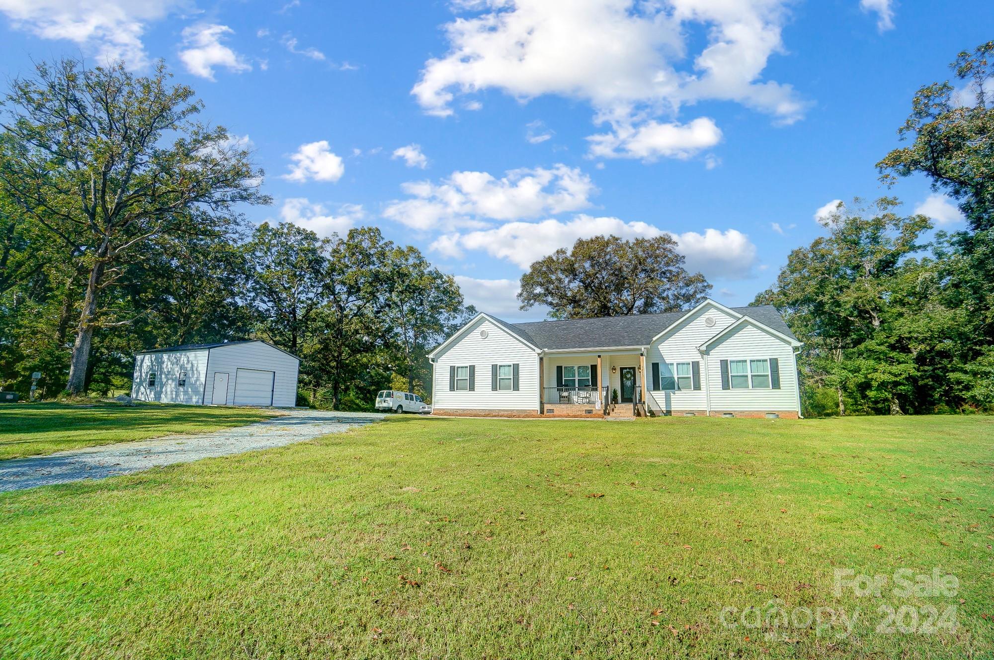 1413 Hamilton Crossroads Road Marshville, NC 28103 - Photo 4 of 42 a front view of a house with a garden