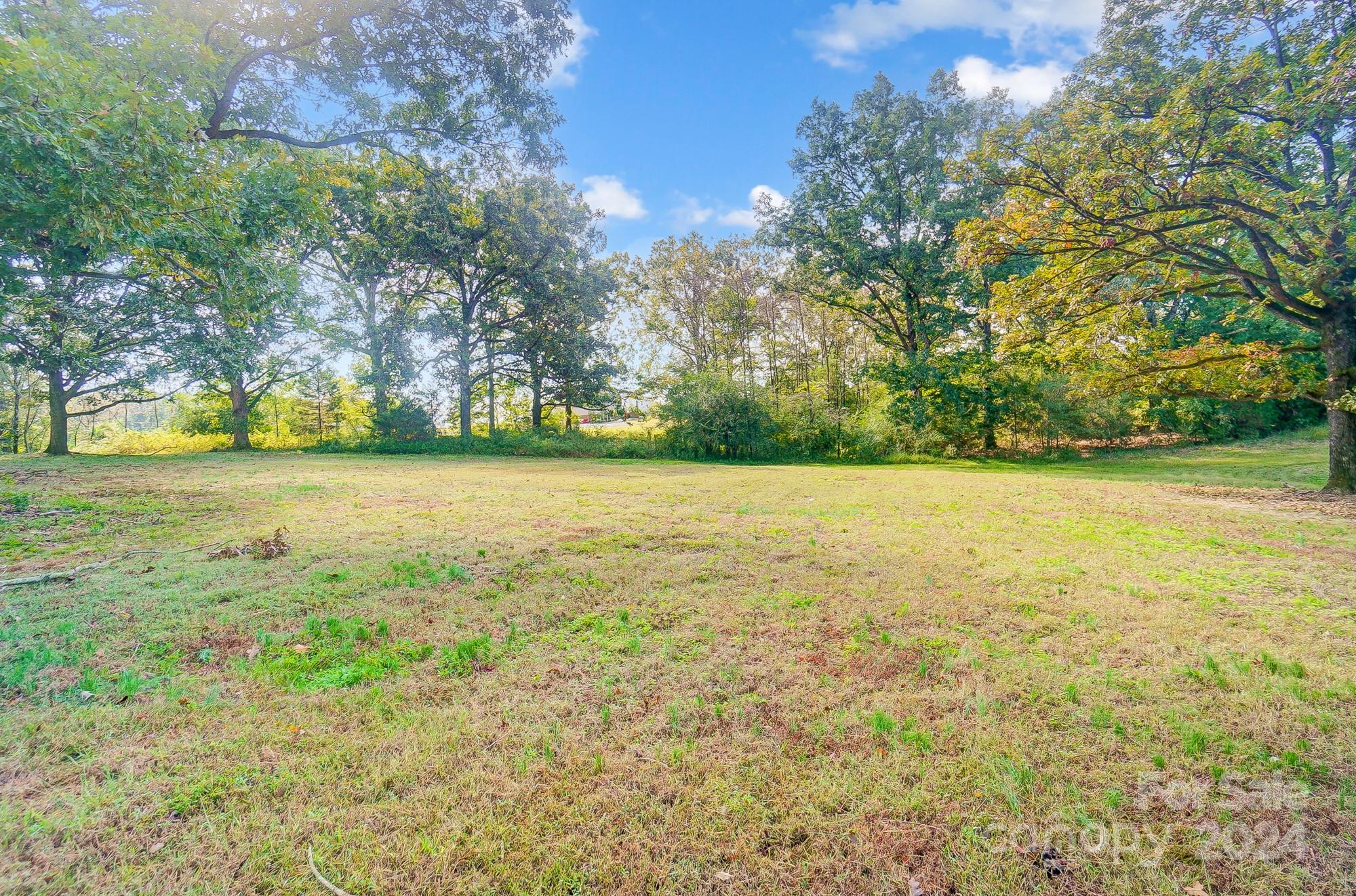1413 Hamilton Crossroads Road Marshville, NC 28103 - Photo 42 of 42 a view of a yard with a tree