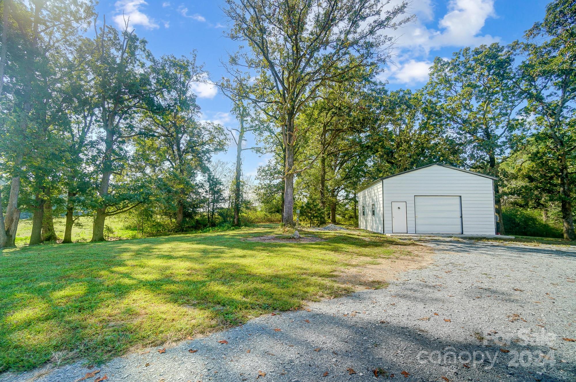 1413 Hamilton Crossroads Road Marshville, NC 28103 - Photo 6 of 42 a big yard with large trees