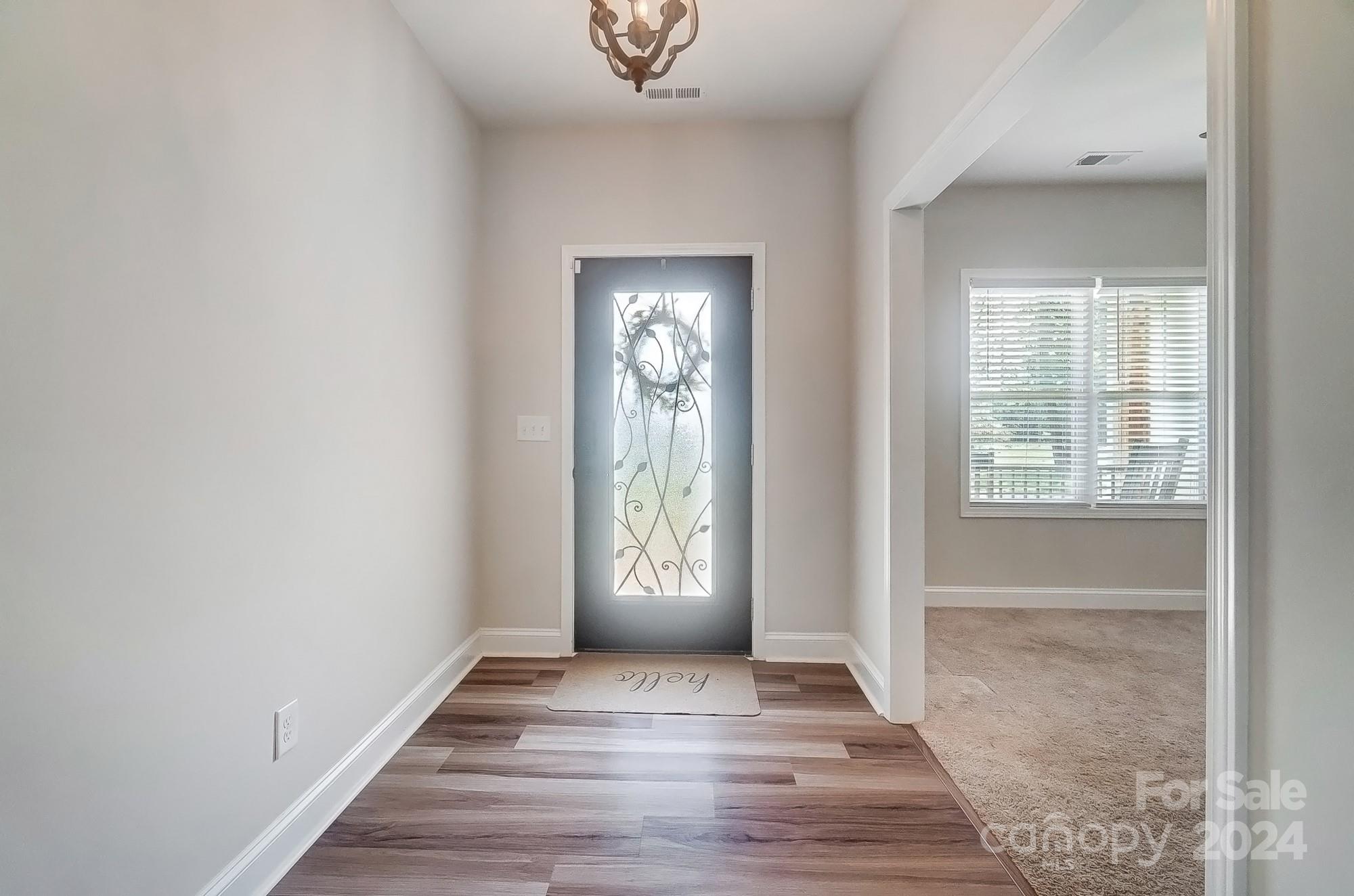 1413 Hamilton Crossroads Road Marshville, NC 28103 - Photo 10 of 42 a view of an entryway with wooden floor