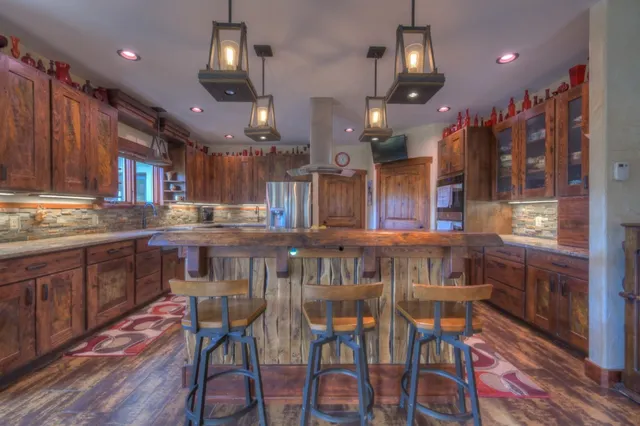 a kitchen with a table and chairs in it