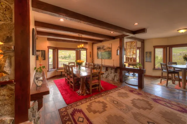 a living room with furniture rug and wooden floor