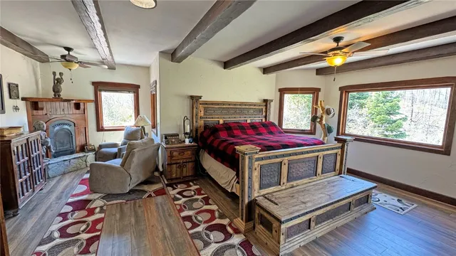 a bedroom with furniture and a window