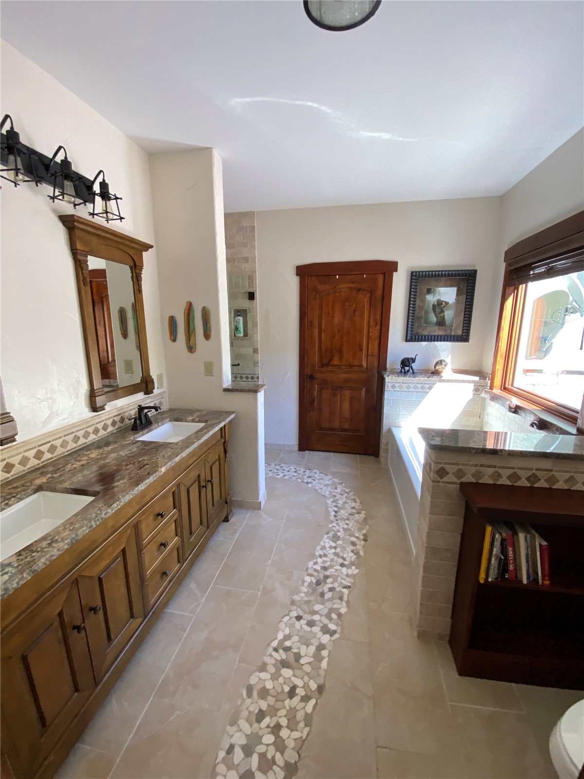 1833 Yellowstone Creek Road Walsenburg, CO 81089 - Photo 25 of 50 a spacious bathroom with a sink and a mirror