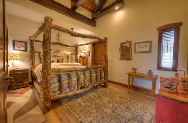 a bedroom with furniture and a window