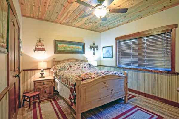 a bedroom with a bed and a table