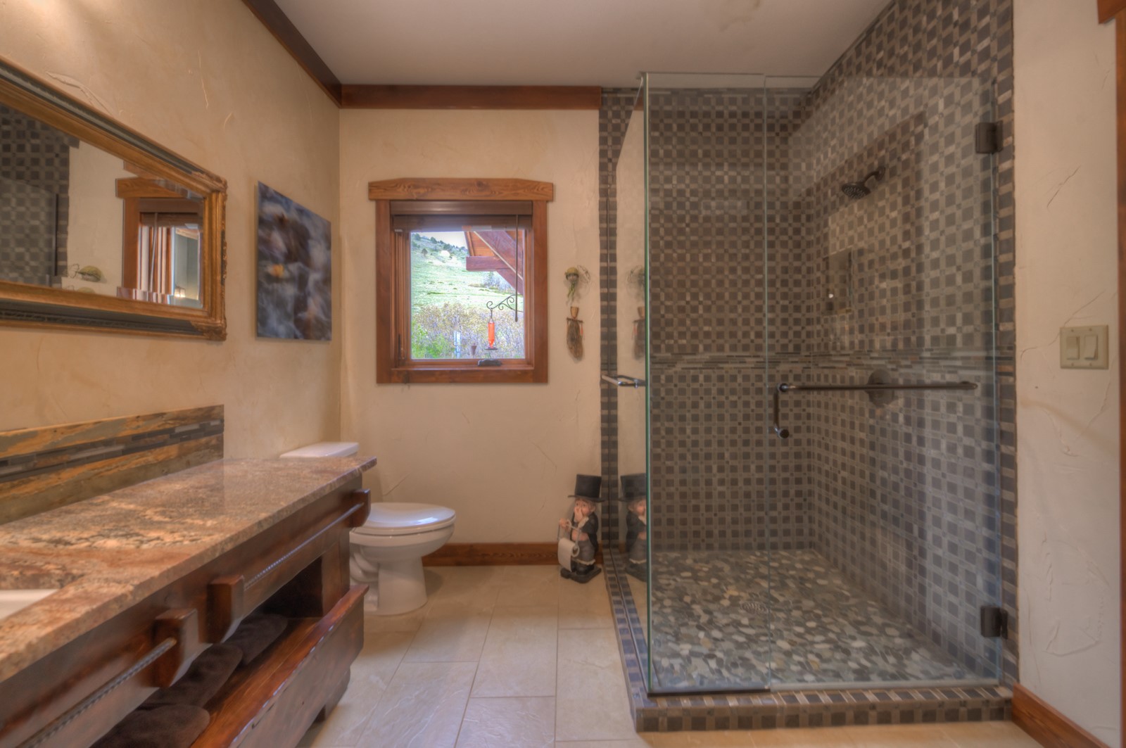 1833 Yellowstone Creek Road Walsenburg, CO 81089 - Photo 31 of 50 a bathroom with a granite countertop sink a toilet and shower