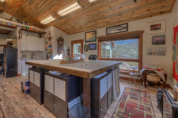 a kitchen with a stove and a refrigerator
