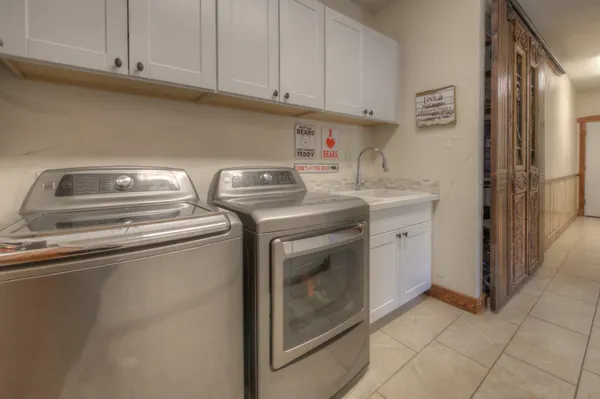 a utility room with dryer and washer