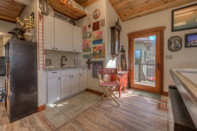 a view of a kitchen with a sink and cabinets