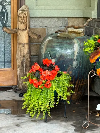 a vase of flowers sitting on a wall