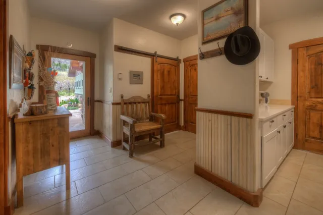 a view of a hallway with seating area