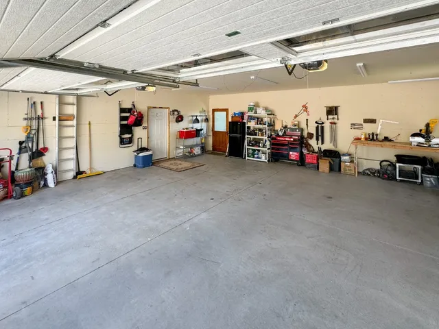 a view of a garage with rack and bicycle