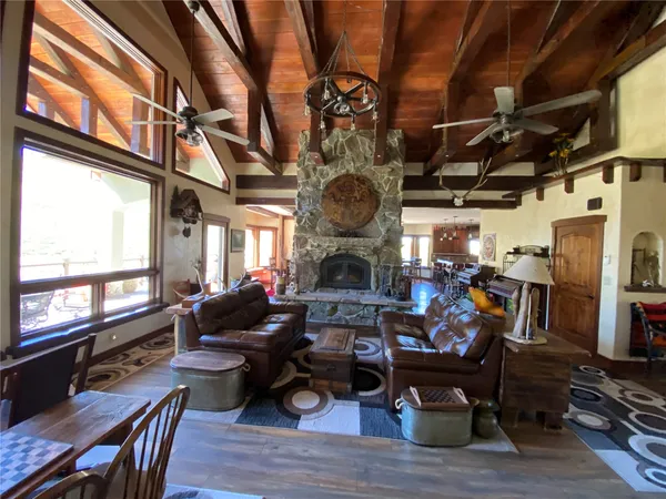 a living room with fireplace furniture and a fireplace