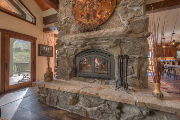 a bedroom with a bed and a fireplace