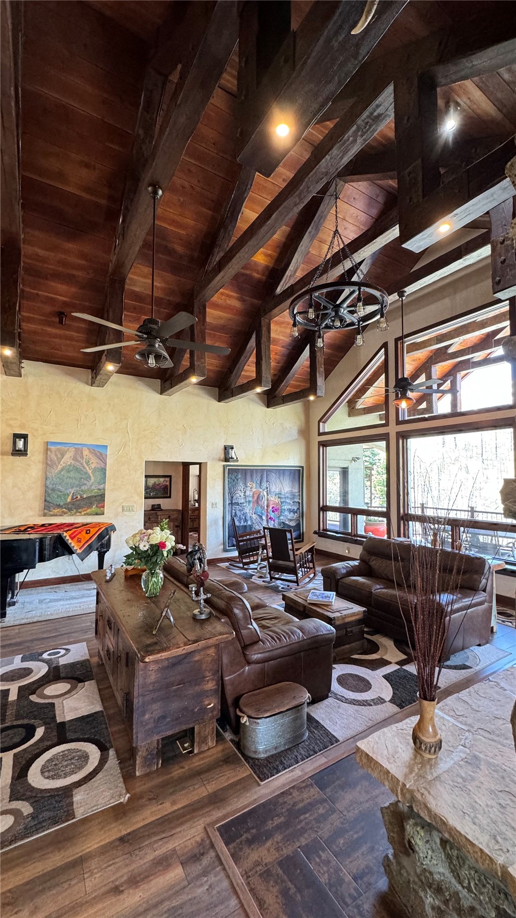 1833 Yellowstone Creek Road Walsenburg, CO 81089 - Photo 9 of 50 a living room with lots of furniture and a chandelier