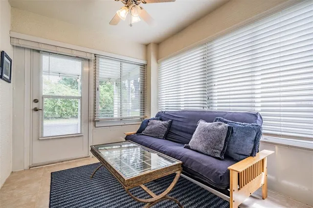 a living room with furniture and a window
