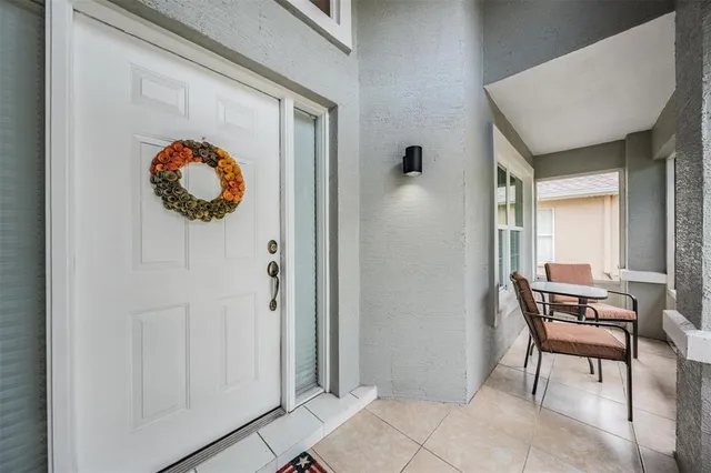 a view of a hallway with seating area