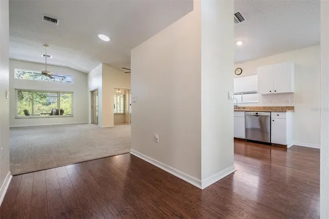 a view of a kitchen with a sink and a window