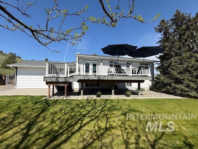 2945 25th Street Clarkston, WA 99403 - Photo 12 of 46 Back of property featuring a wooden deck and a lawn