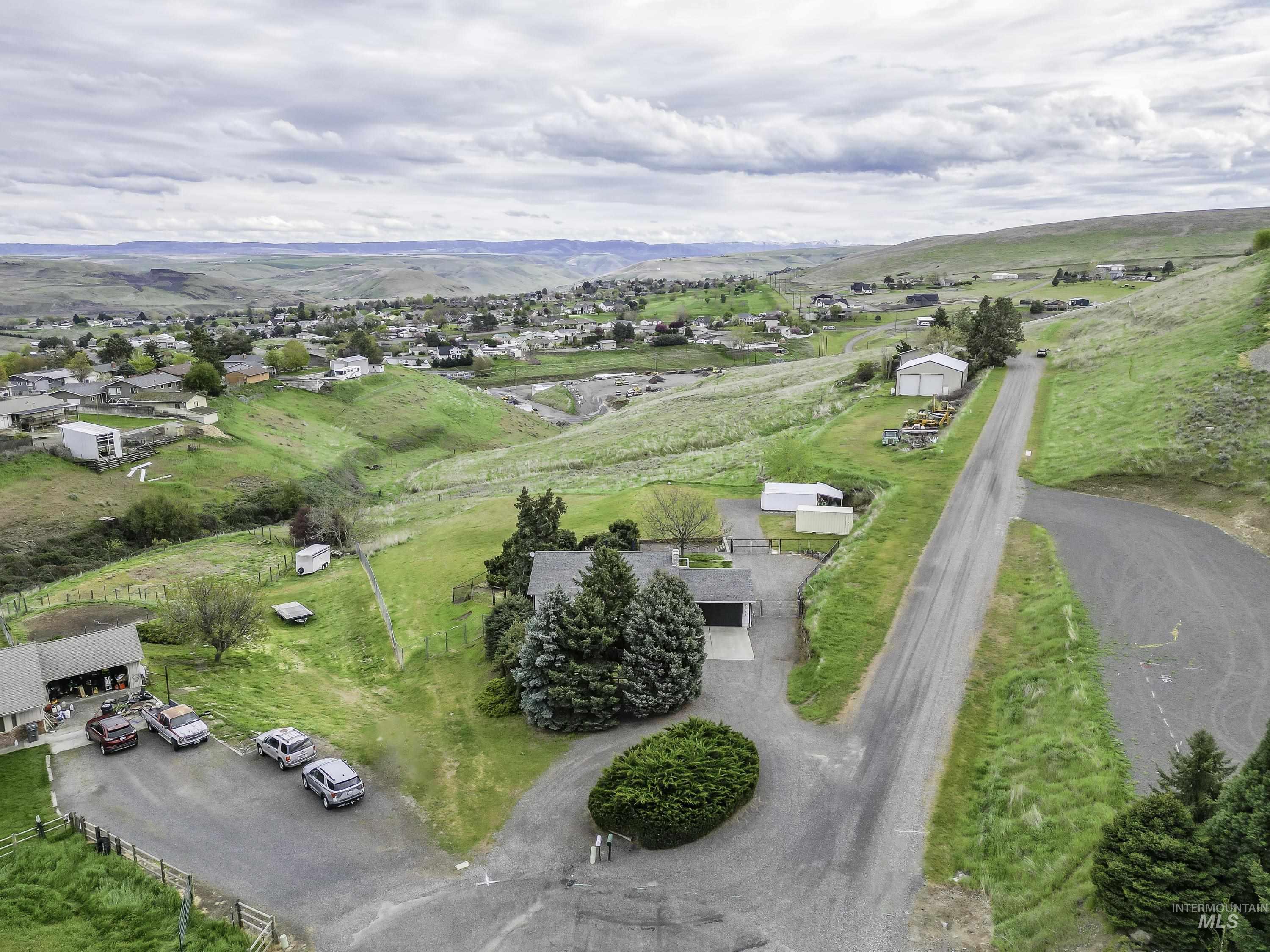 2945 25th Street Clarkston, WA 99403 - Photo 20 of 46 Aerial view of residential area with a mountain backdrop