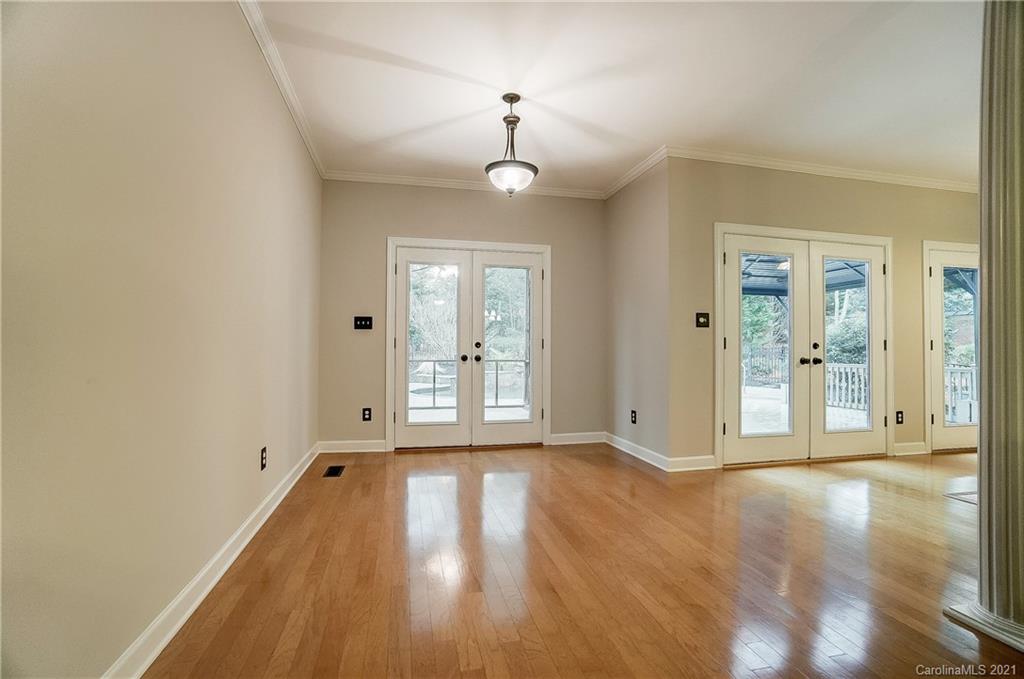 7064 Harbor Court Tega Cay, SC 29708 - Photo 14 of 48 a view of a room with wooden floor and windows