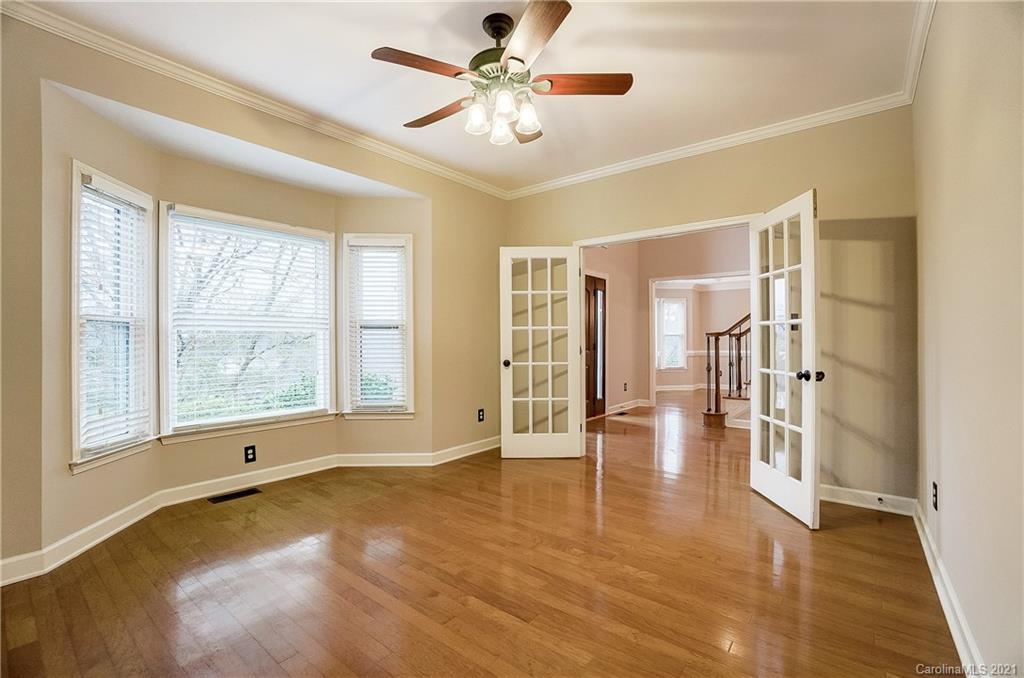 7064 Harbor Court Tega Cay, SC 29708 - Photo 17 of 48 a view of an empty room with window and a kitchen