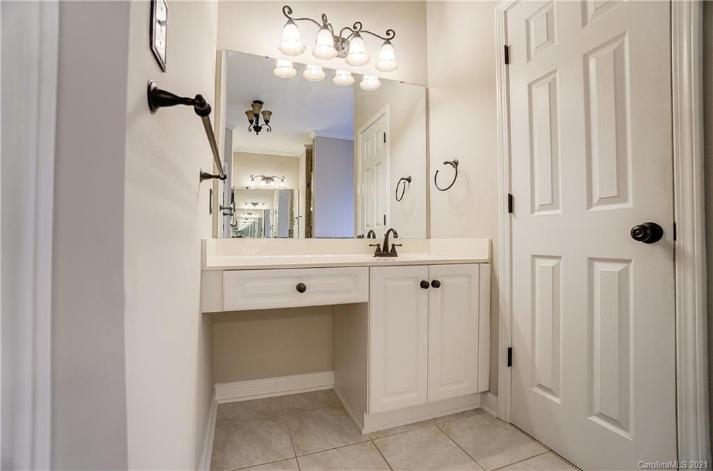 7064 Harbor Court Tega Cay, SC 29708 - Photo 24 of 48 a bathroom with a double vanity sink mirror and