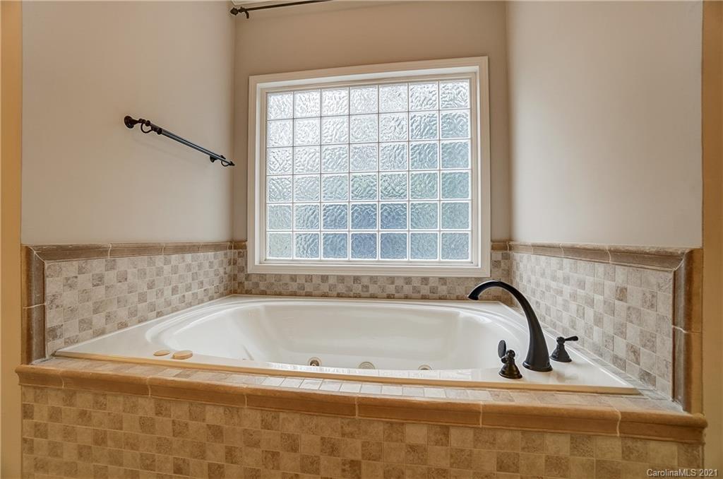 7064 Harbor Court Tega Cay, SC 29708 - Photo 26 of 48 a bathroom with bathtub