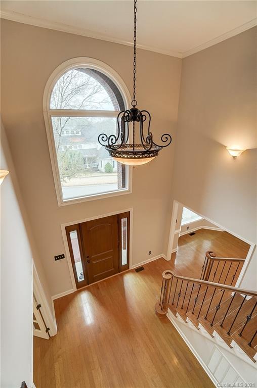 7064 Harbor Court Tega Cay, SC 29708 - Photo 29 of 48 a view of an empty room with wooden floor and a window