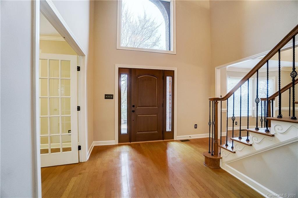 7064 Harbor Court Tega Cay, SC 29708 - Photo 4 of 48 a view of an entryway with wooden floor and door