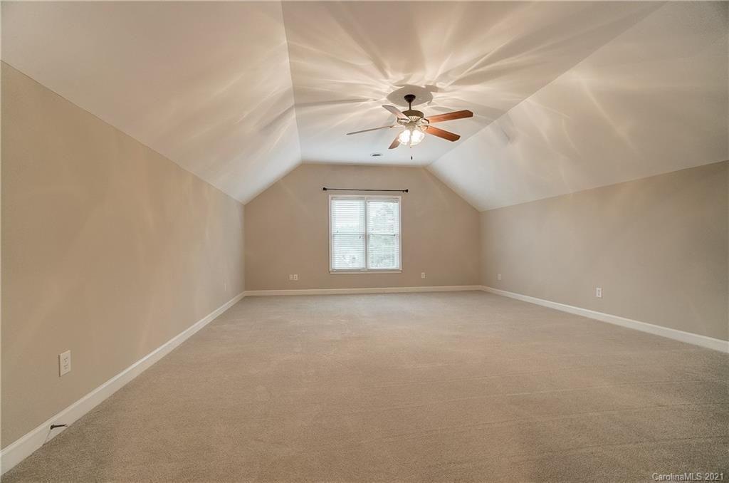 7064 Harbor Court Tega Cay, SC 29708 - Photo 31 of 48 a view of a big room with fan and windows