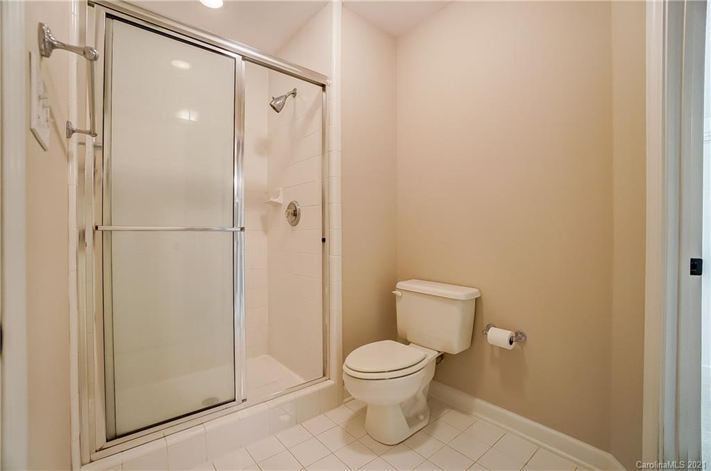 7064 Harbor Court Tega Cay, SC 29708 - Photo 34 of 48 a bathroom with a toilet shower and a window