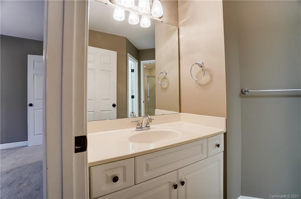 7064 Harbor Court Tega Cay, SC 29708 - Photo 36 of 48 a bathroom with a sink vanity and a mirror