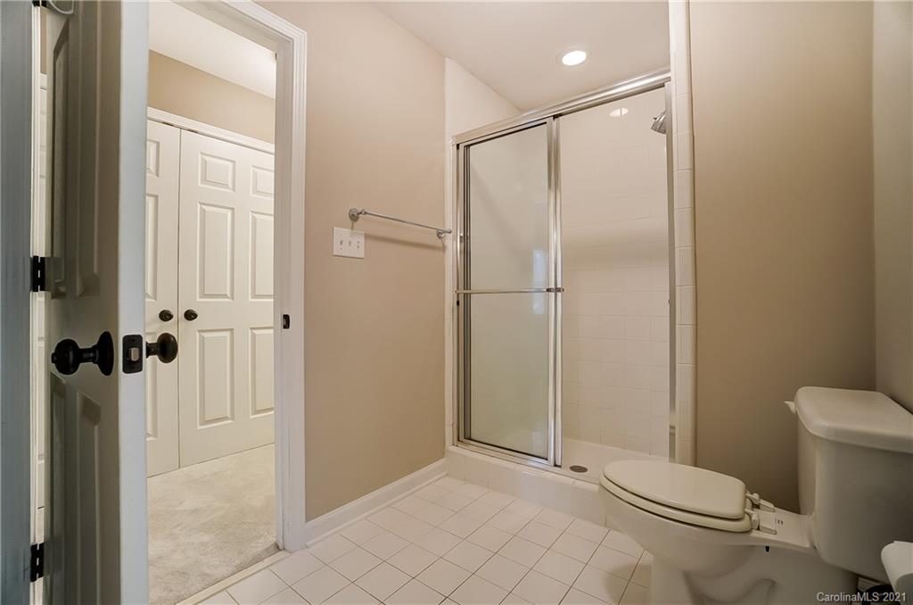 7064 Harbor Court Tega Cay, SC 29708 - Photo 37 of 48 a bathroom with a shower and a toilet
